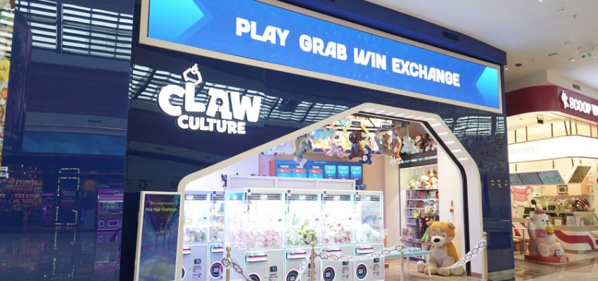 Claw Culture game area showing claw machines filled with plush prizes