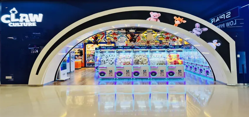 Claw Culture arcade with rows of colourful claw machines and plush prizes